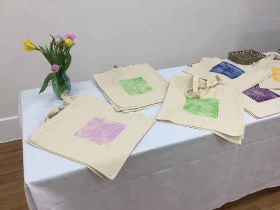 Tote bags laid onto a table